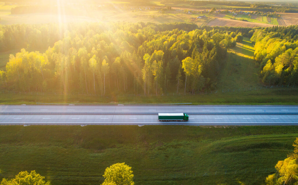 Truck on highway in evening sunlight