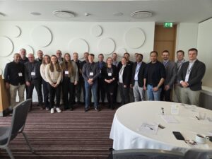 Group photo of NVF Road Technology seminar participants gathered indoors during the event in Reykjavík.